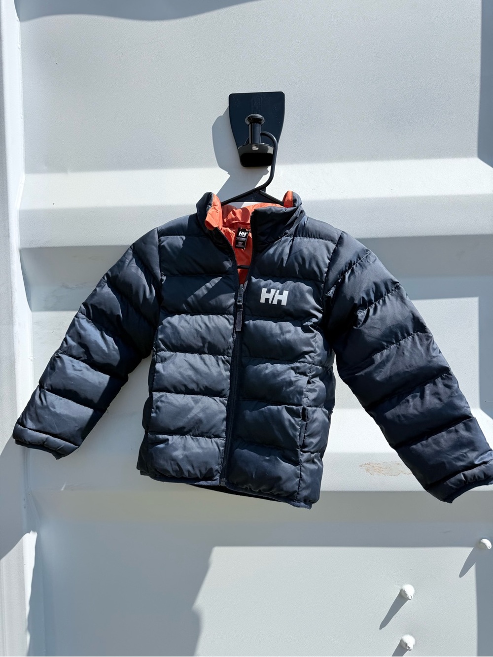 Helly Hansen Kids Puffer Jacket in Navy with Orange Lining